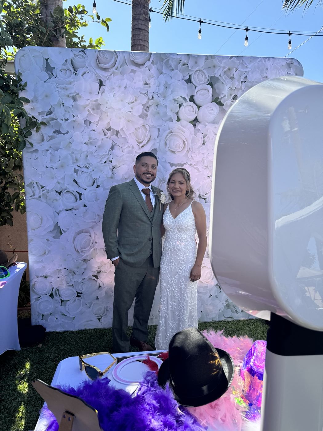 Wedding couple with photo booth setup