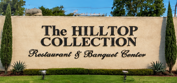 Straight-on view of The Hilltop Collection Restaurant and Banquet Center sign